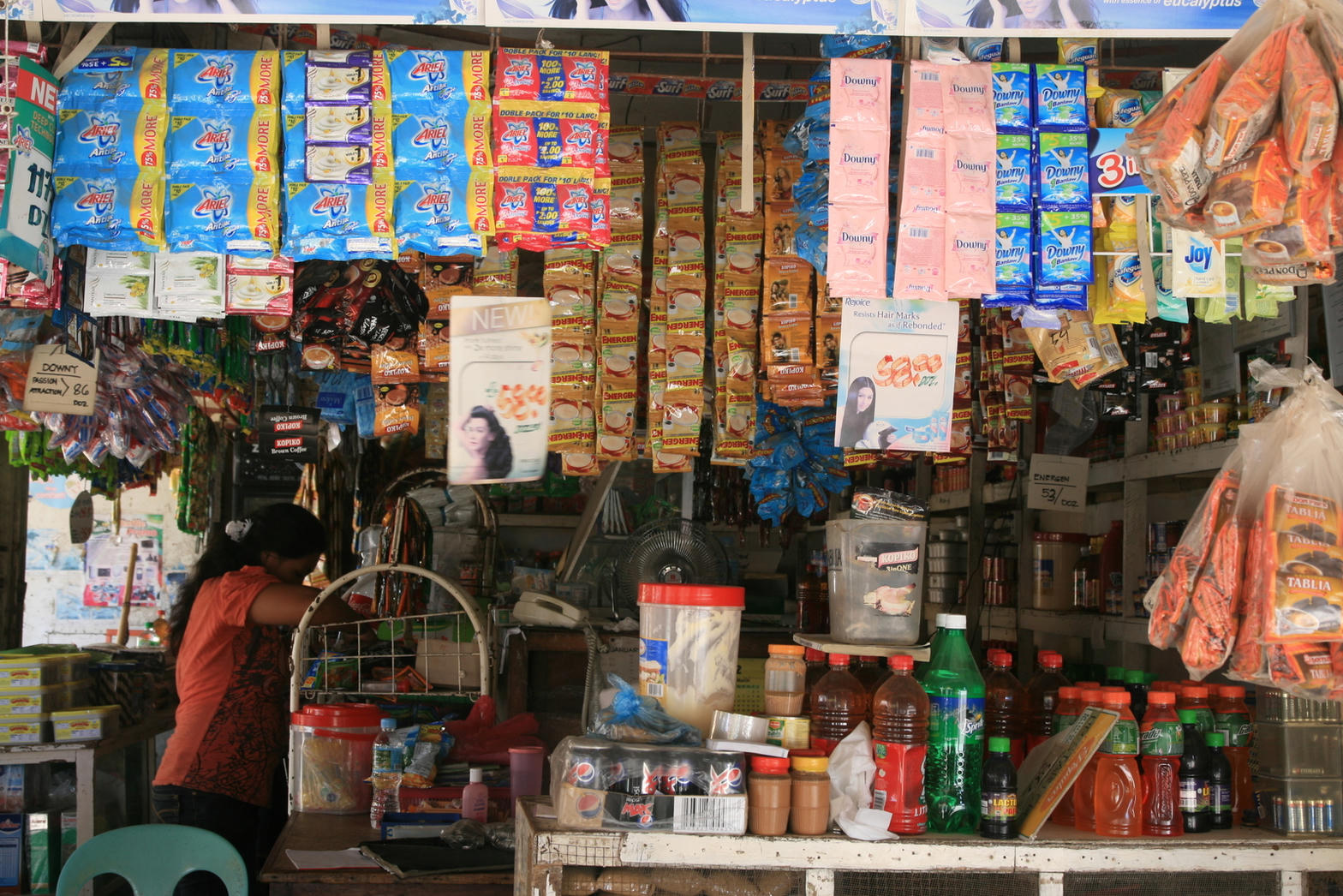 Mint-painted sari-sari with a fresh tarp. Caloocan.